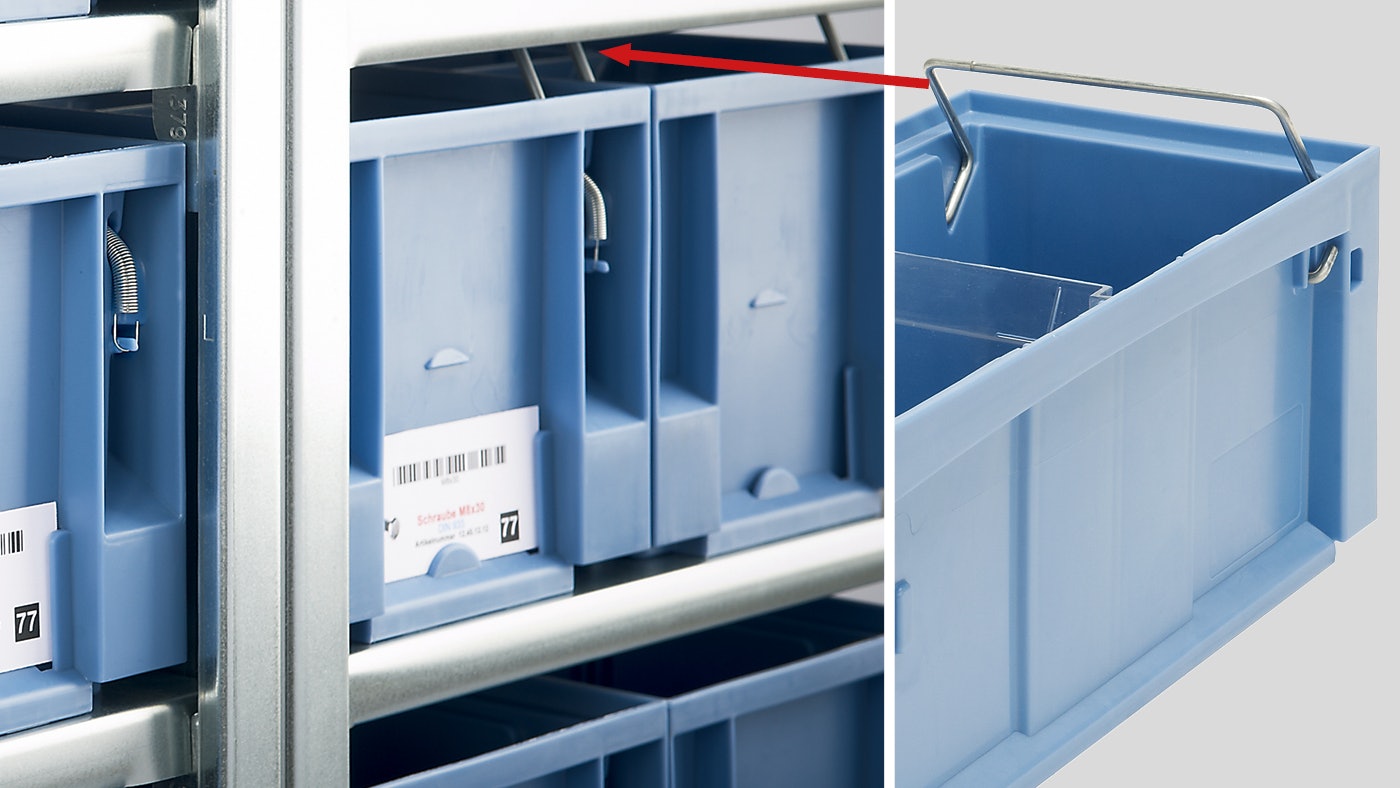 De foto toont een magazijnbak waarop de beugel te zien is.