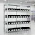 Racks with black storage containers in warehouse