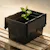 Black storage box with plant on wooden pallet