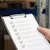 Man holds a checklist in a warehouse